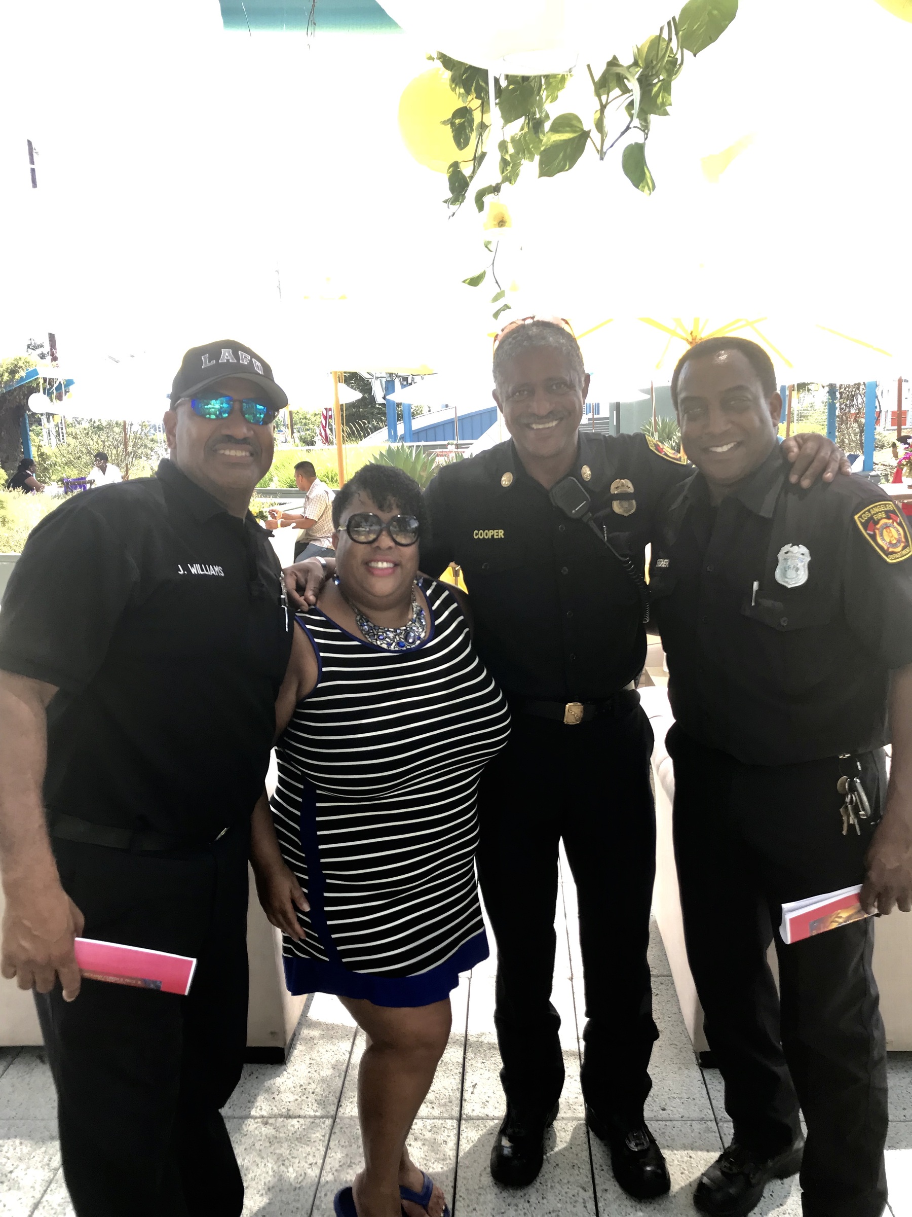 Noreen McClendon with LAFD officers at South Central LA community event